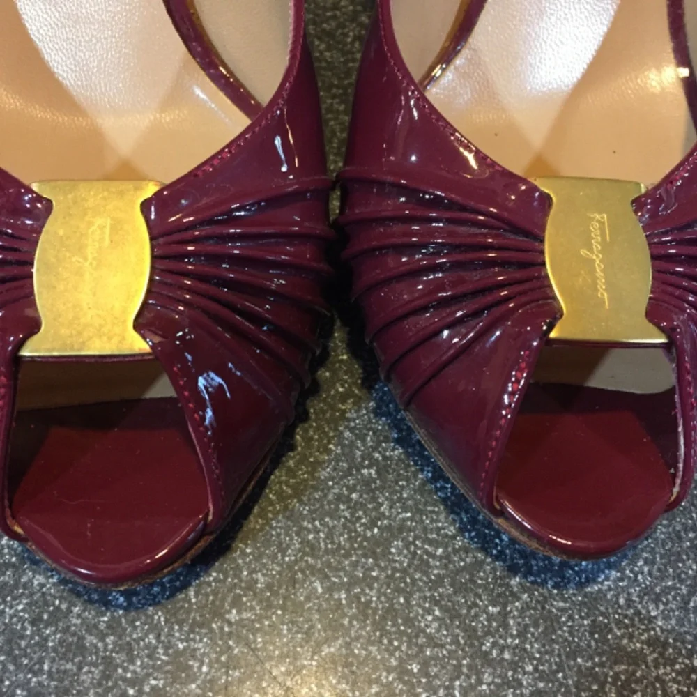 Salvatore Ferragamo Burgundy Patent Peep-Toe Heels with Gold Accent